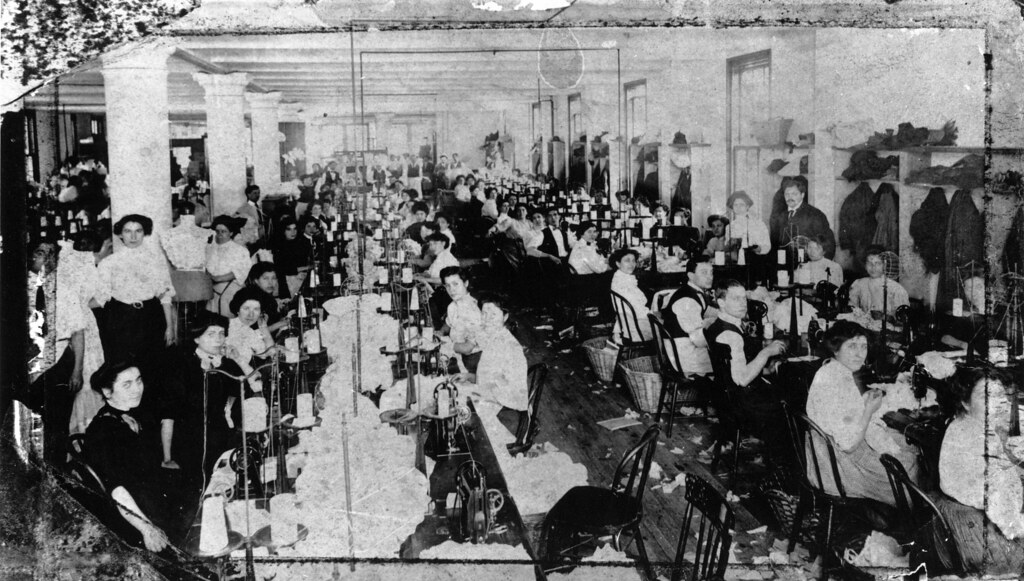 A vintage shop scene of sewing and dress fitting