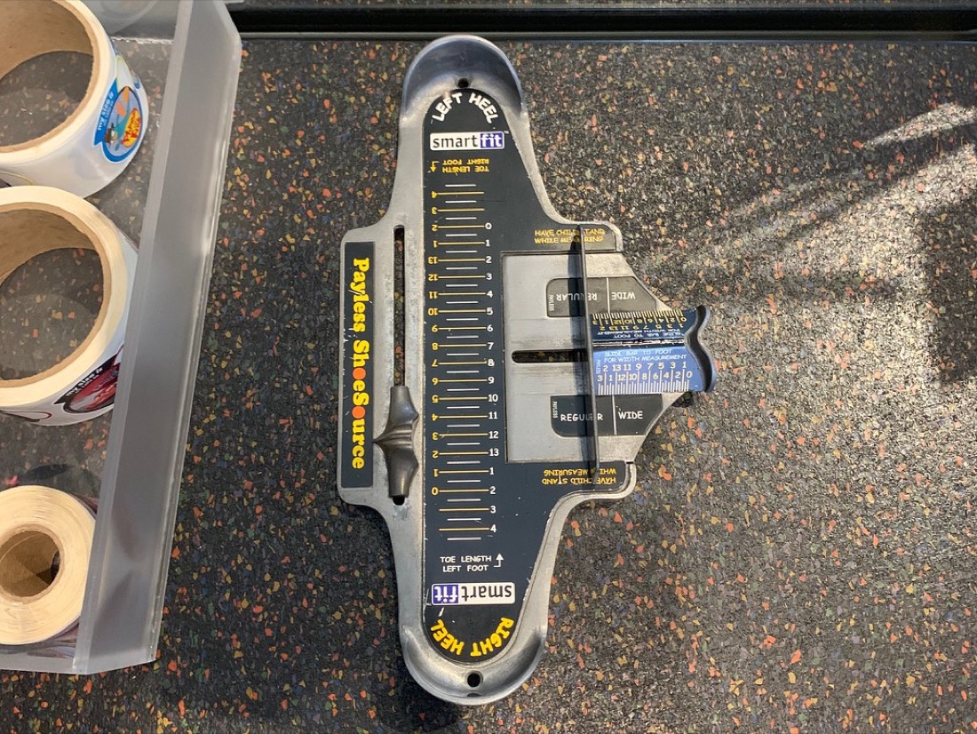A Brannock device for measuring feet in a shoe store