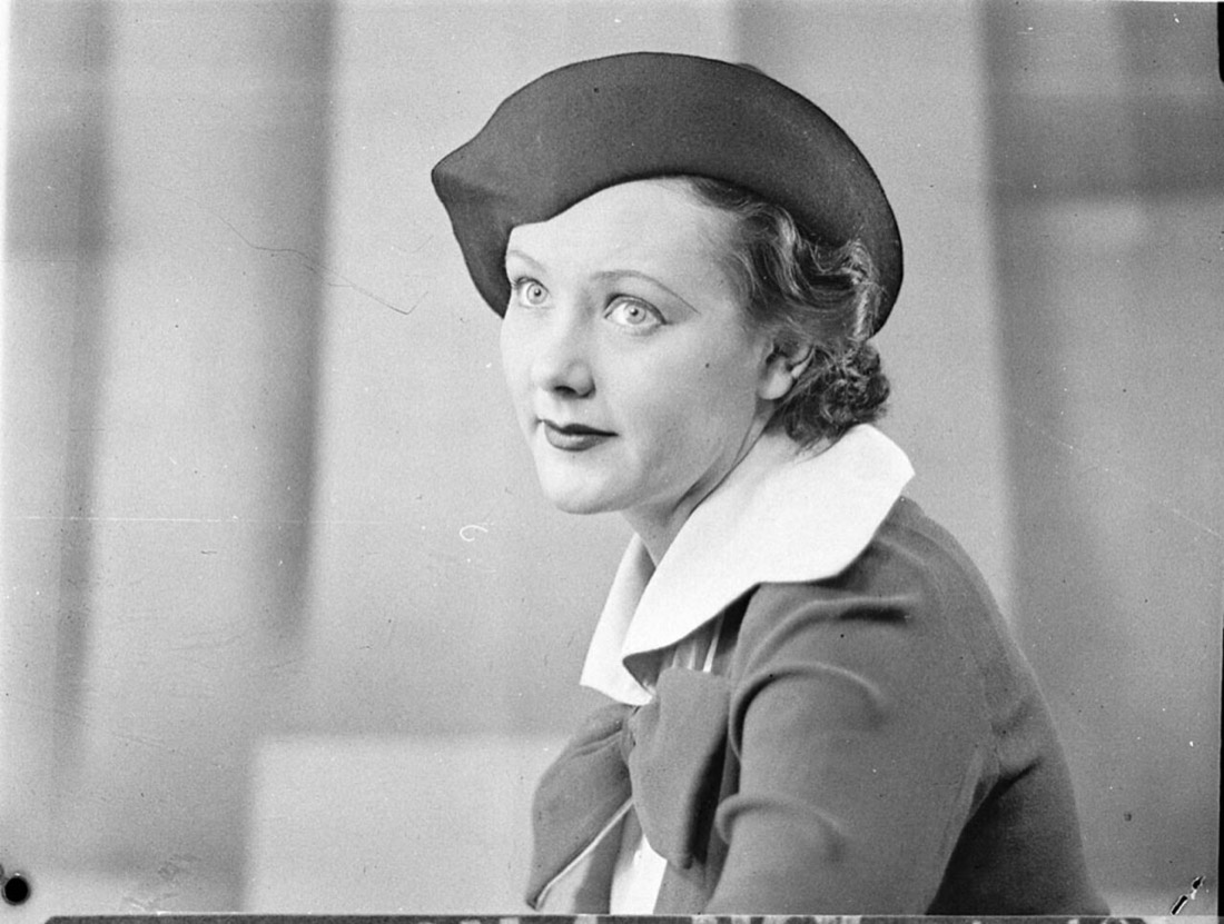 A vintage fashion model wearing a hat
